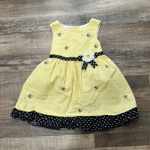 Counting Daisies • yellow and white sear sucker dress with embroidered b…